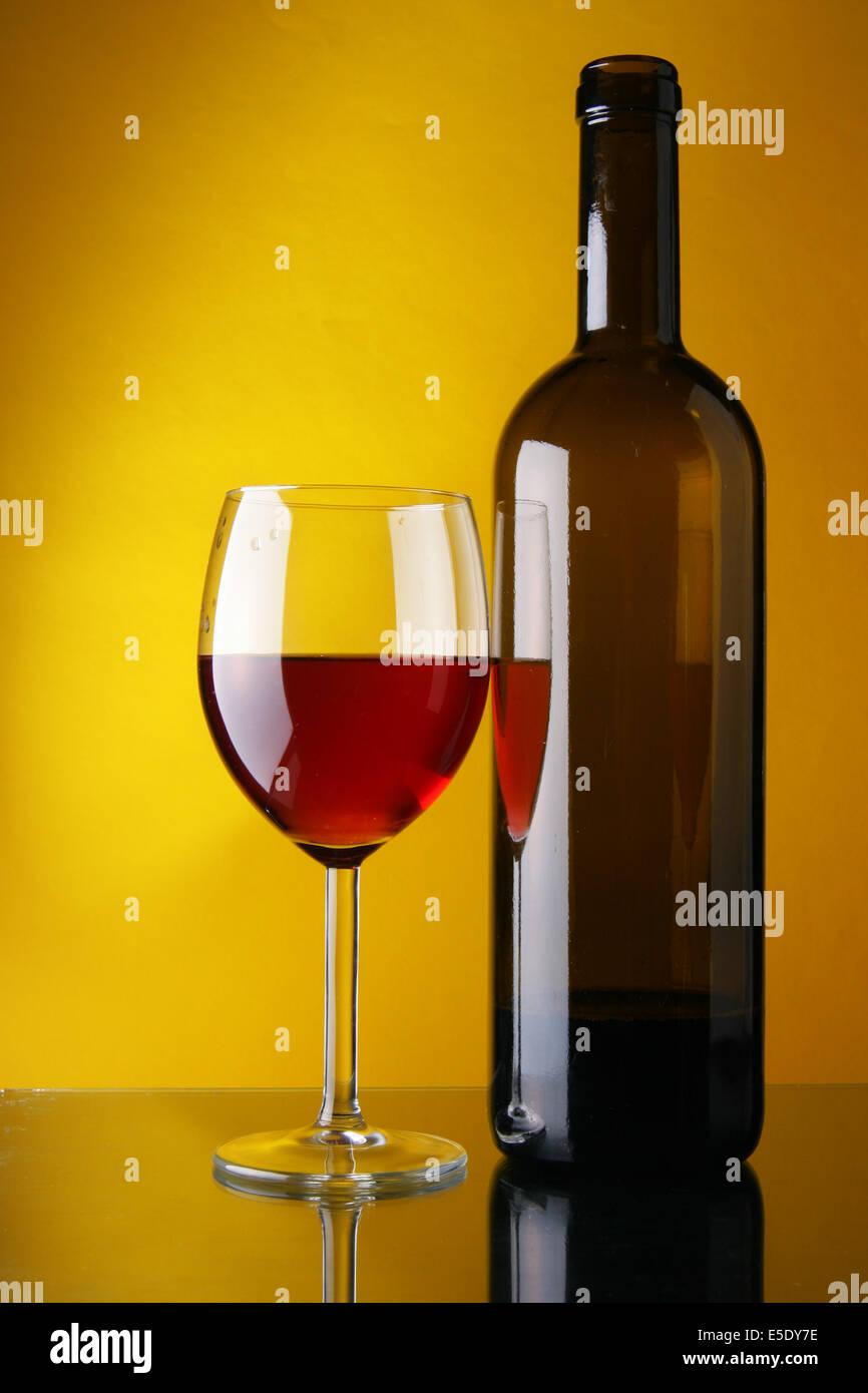 Download Wineglass And Bottle Of Red Wine Over Yellow Background Stock Photo Alamy Yellowimages Mockups