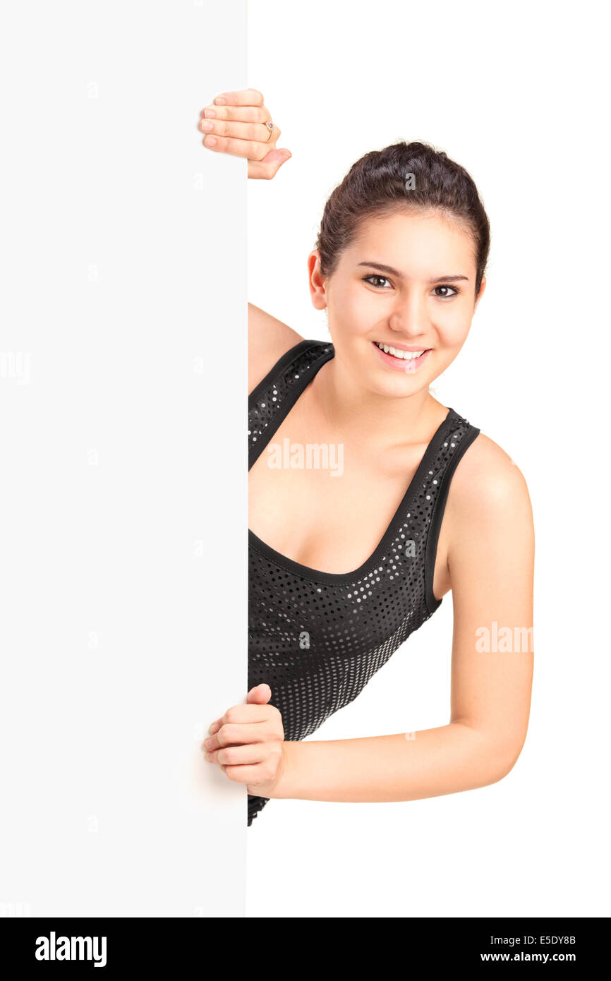 Young woman standing behind a blank panel Stock Photo - Alamy