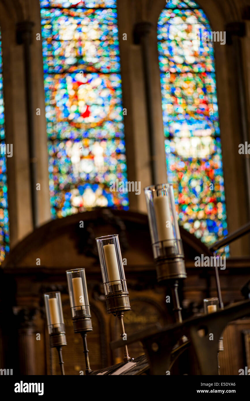 Candles and stained glass windows at Temple Church. The Temple Church