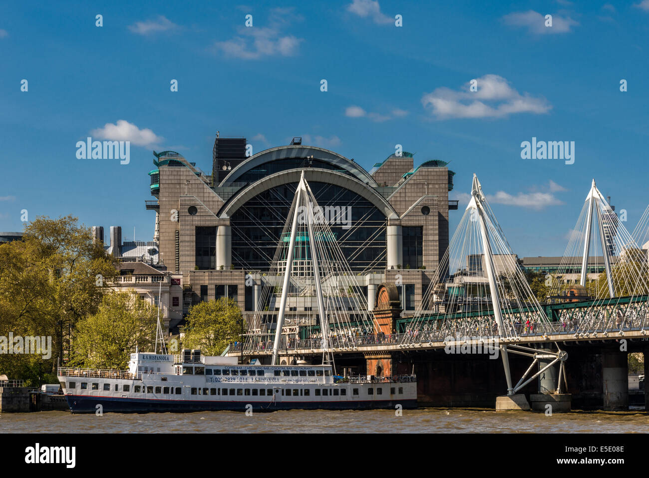 The Hungerford Bridge crosses the River Thames in London. It is a steel