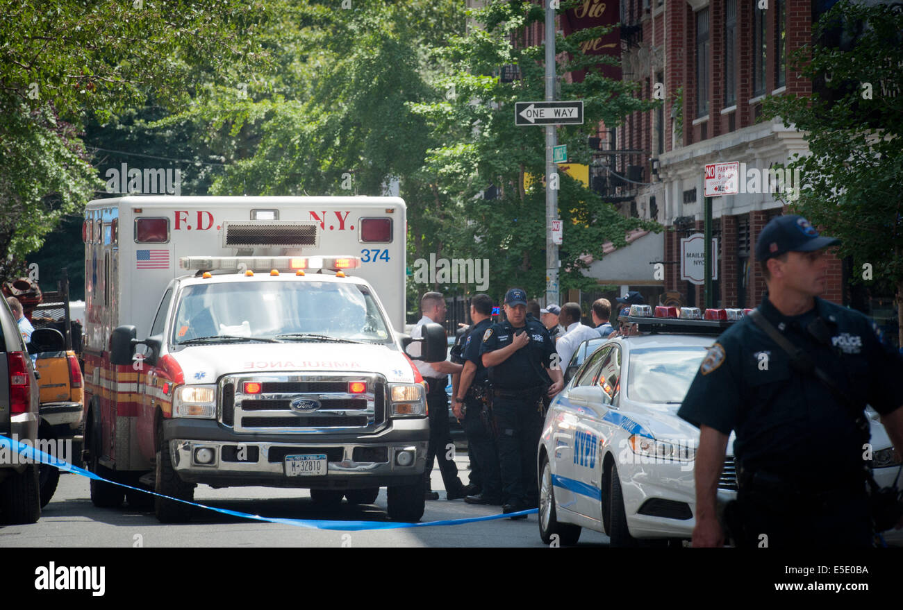 Manhattan, New York, USA. 28th July, 2014. An FDNY Ambulance leaves the scene as two U.S. Marshals and an NYPD Detective were shot on West 4th Street near at Jones Street while trying to arrest suspected child molester Charles Mozdir, who was shot and killed, Monday, July 28, 2014. Credit:  Bryan Smith/ZUMA Wire/Alamy Live News Stock Photo