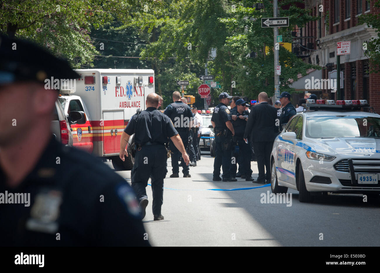 Manhattan, New York, USA. 28th July, 2014. An FDNY Ambulance on the scene as two U.S. Marshals and an NYPD Detective were shot on West 4th Street near at Jones Street while trying to arrest suspected child molester Charles Mozdir, who was shot and killed, Monday, July 28, 2014. Credit:  Bryan Smith/ZUMA Wire/Alamy Live News Stock Photo