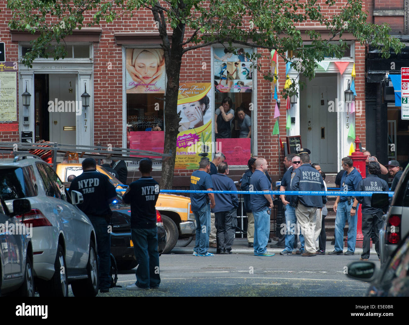 Manhattan, New York, USA. 28th July, 2014. Two U.S. Marshals and an NYPD Detective were shot on West 4th Street near at Jones Street while trying to arrest suspected child molester Charles Mozdir, who was shot and killed, Monday, July 28, 2014. Credit:  Bryan Smith/ZUMA Wire/Alamy Live News Stock Photo