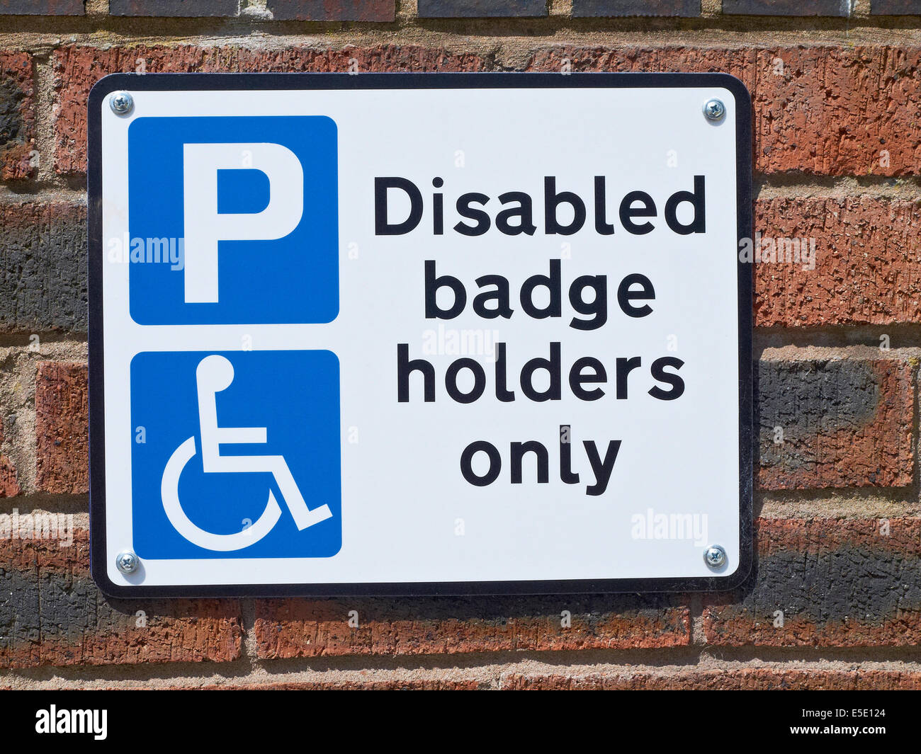 Disabled badge holders only parking sign UK Stock Photo