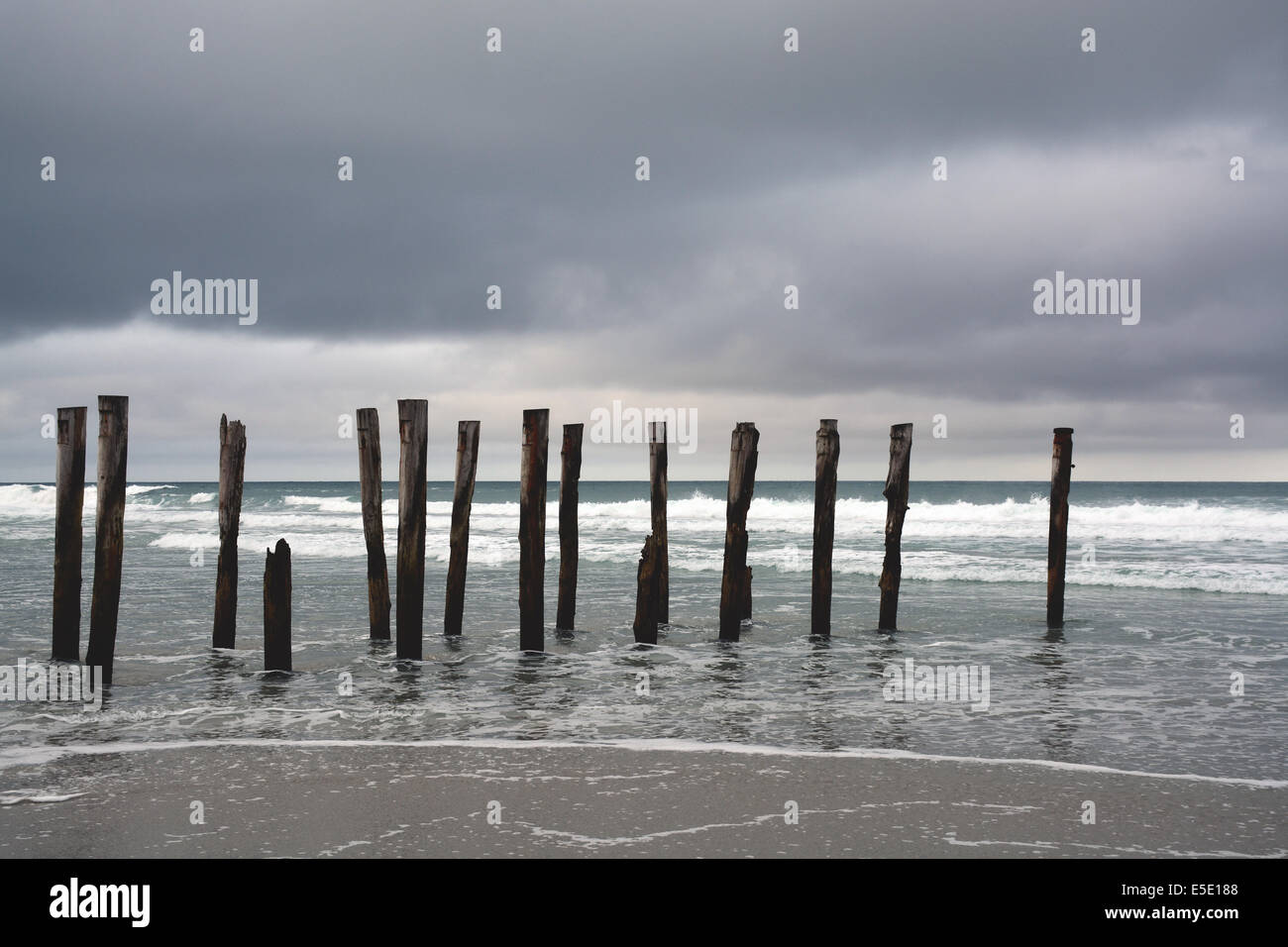 Old pier of St Clair Beach on a stormy day, Dunedin, New Zealand Stock Photo