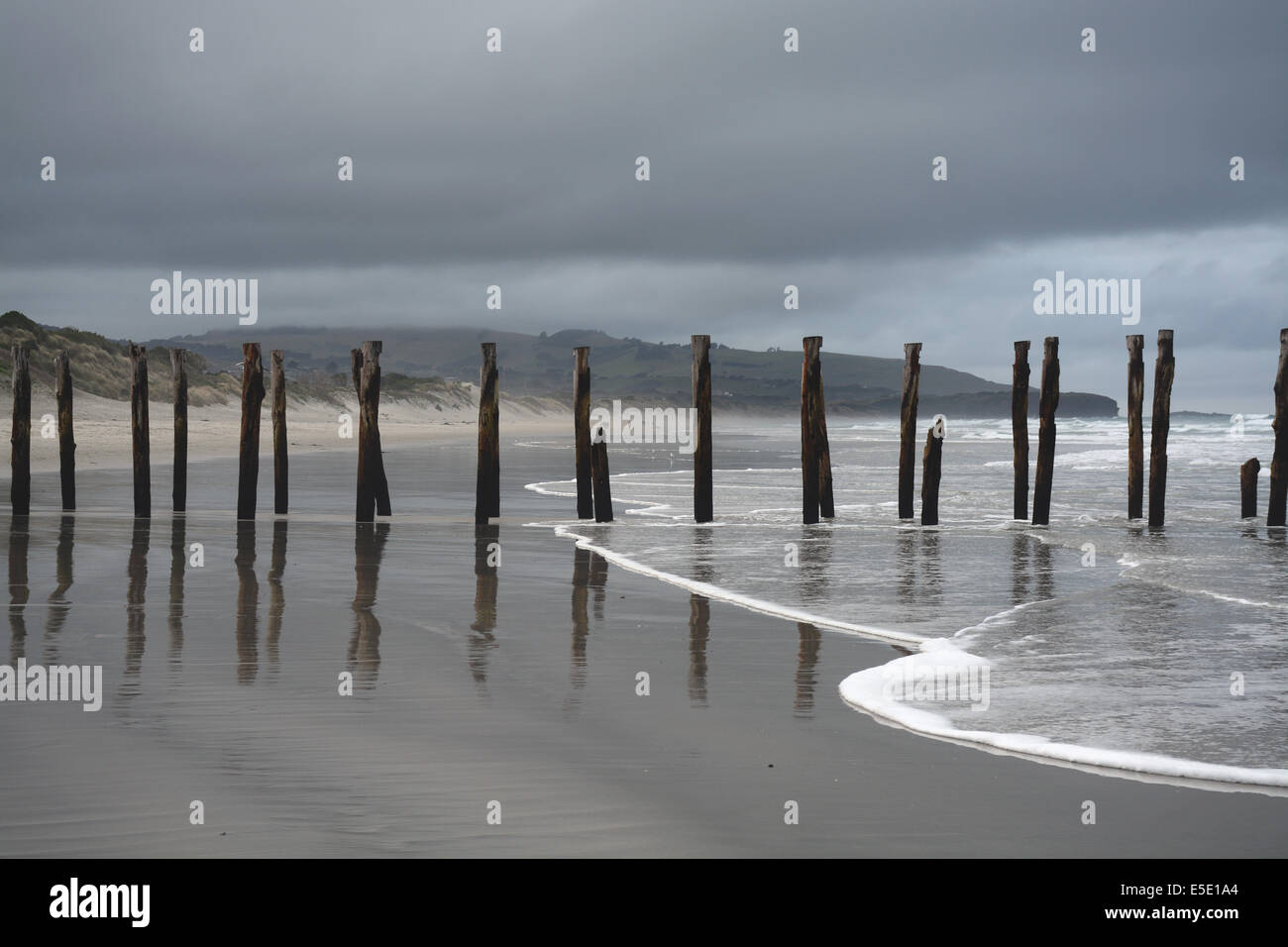 Old pier of St Clair Beach on a stormy day, Dunedin, New Zealand Stock Photo