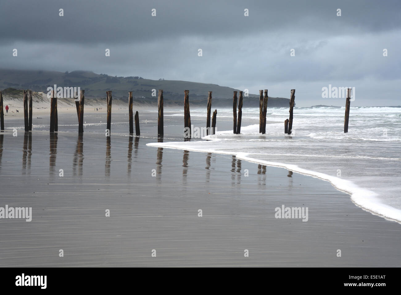 Old pier of St Clair Beach on a stormy day, Dunedin, New Zealand Stock Photo