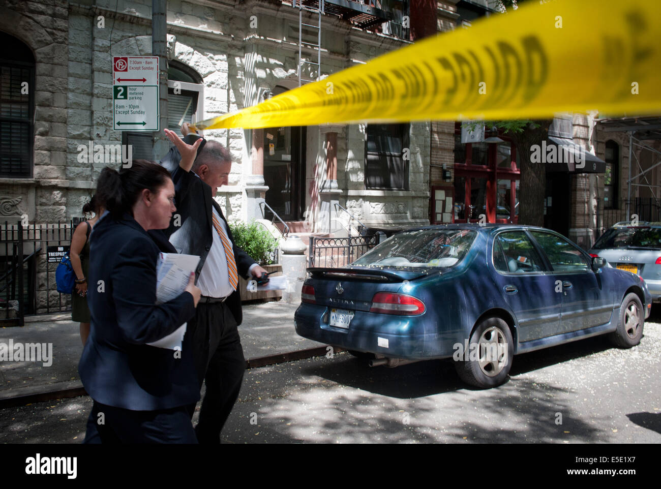 Manhattan, New York, USA. 28th July, 2014. Detectives enter the scene as two U.S. Marshals and an NYPD Detective were shot on West 4th Street near at Jones Street while trying to arrest suspected child molester Charles Mozdir, who was shot and killed, Monday, July 28, 2014. Credit:  Bryan Smith/ZUMA Wire/Alamy Live News Stock Photo