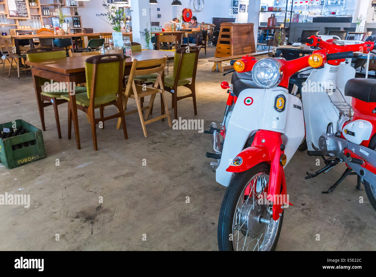 amsterdam, Holland, The Netherlands, Shopping, Motorscooters on DIsplay inside the Hutspot Concept Store, recycled furniture shop interior 1960s Stock Photo