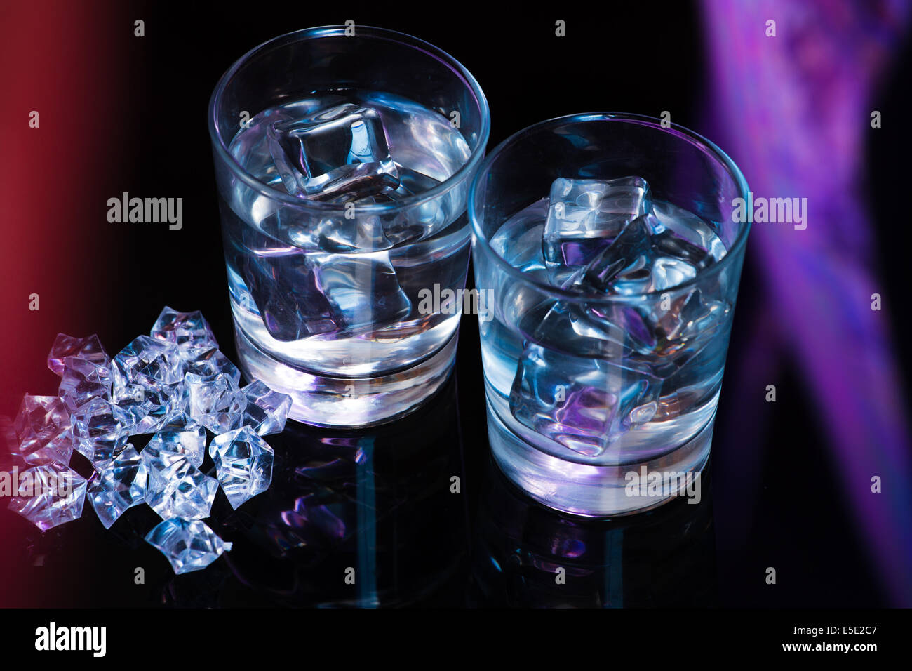 Two glasses of vodka with ice cubes Stock Photo