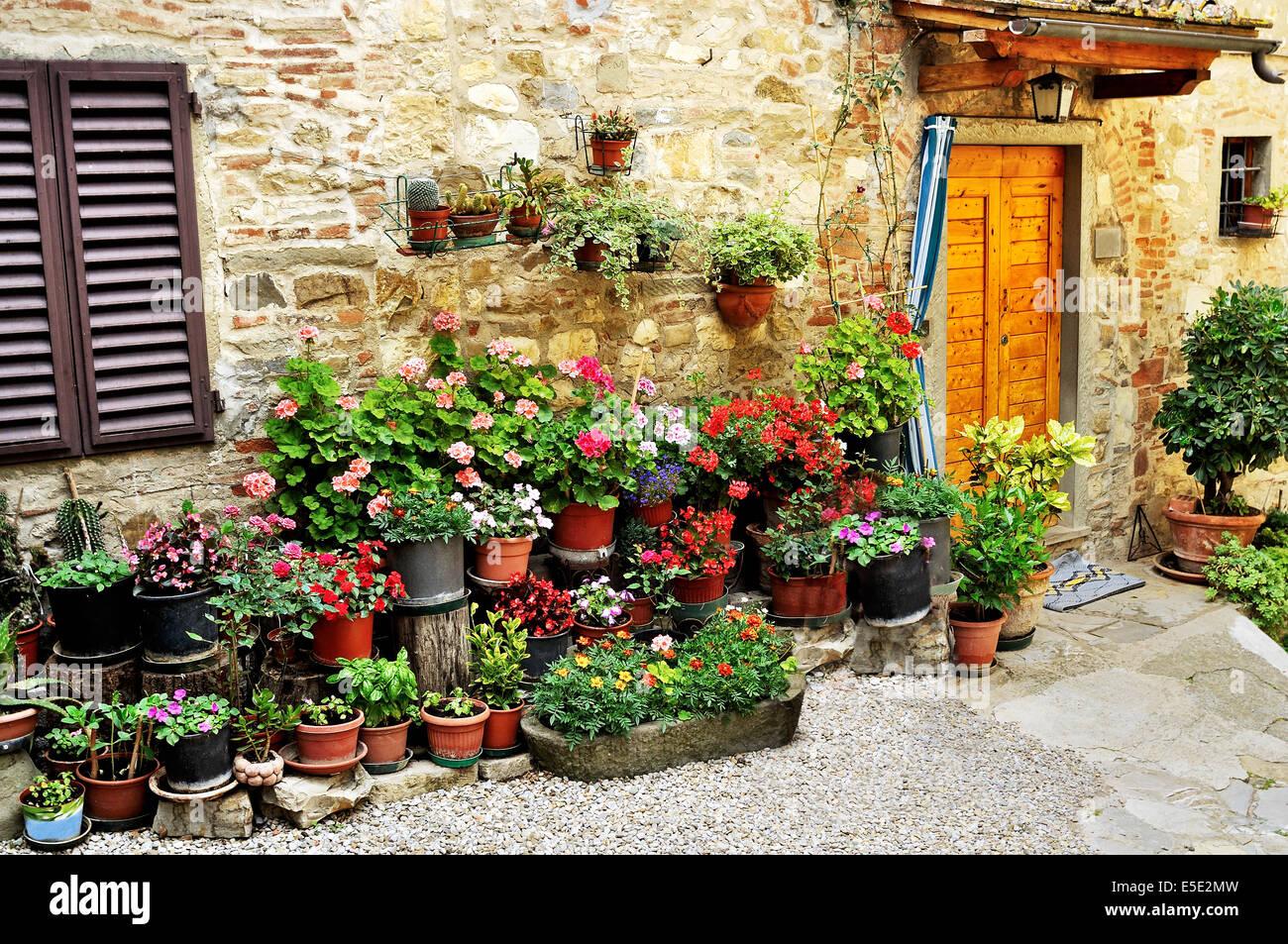 House in Italy with many potted flower plants Stock Photo Alamy