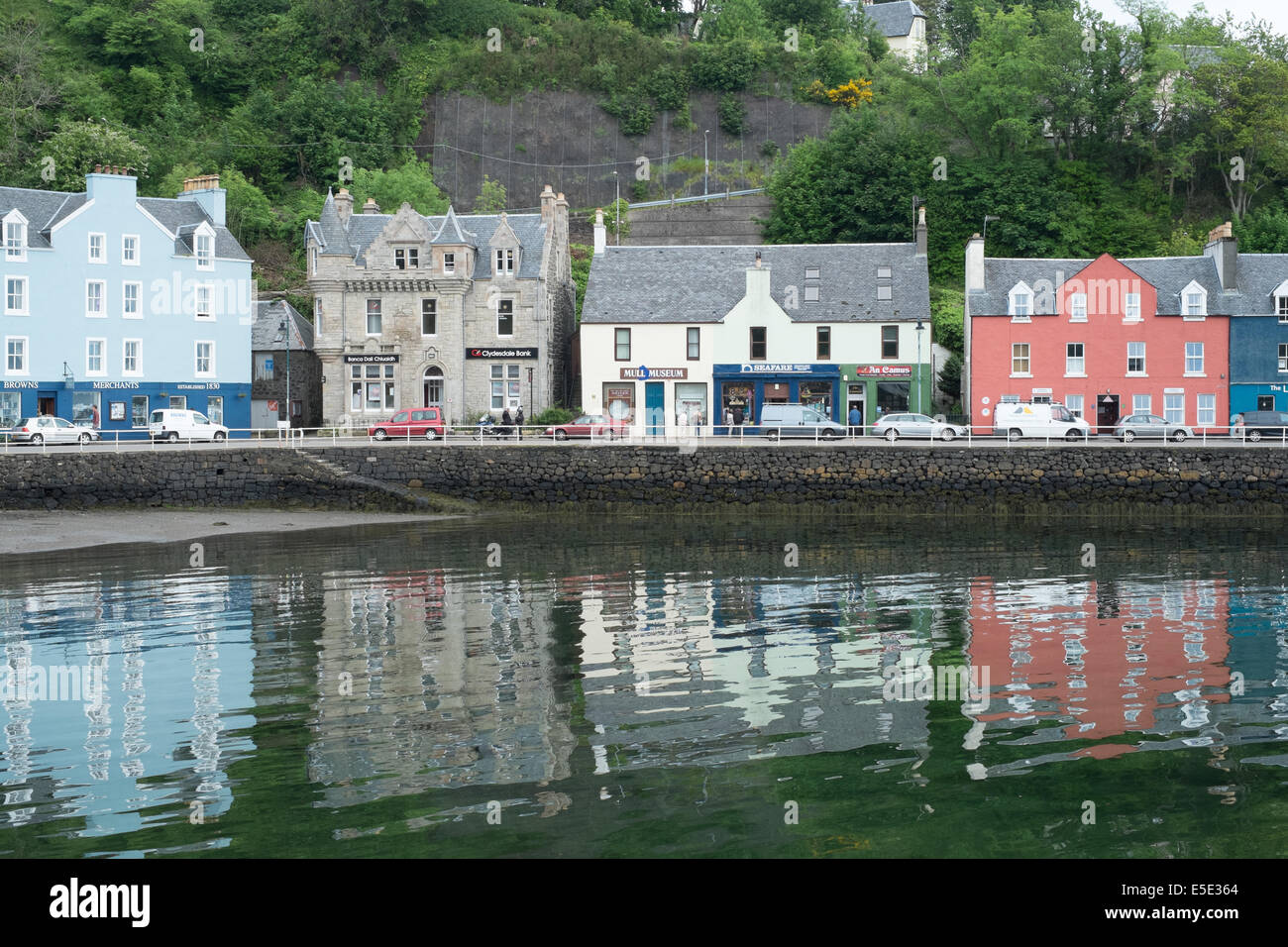 Salt water reflections of houses in the harbour, Tobermory, Isle of Mull, Scottish islands Stock Photo