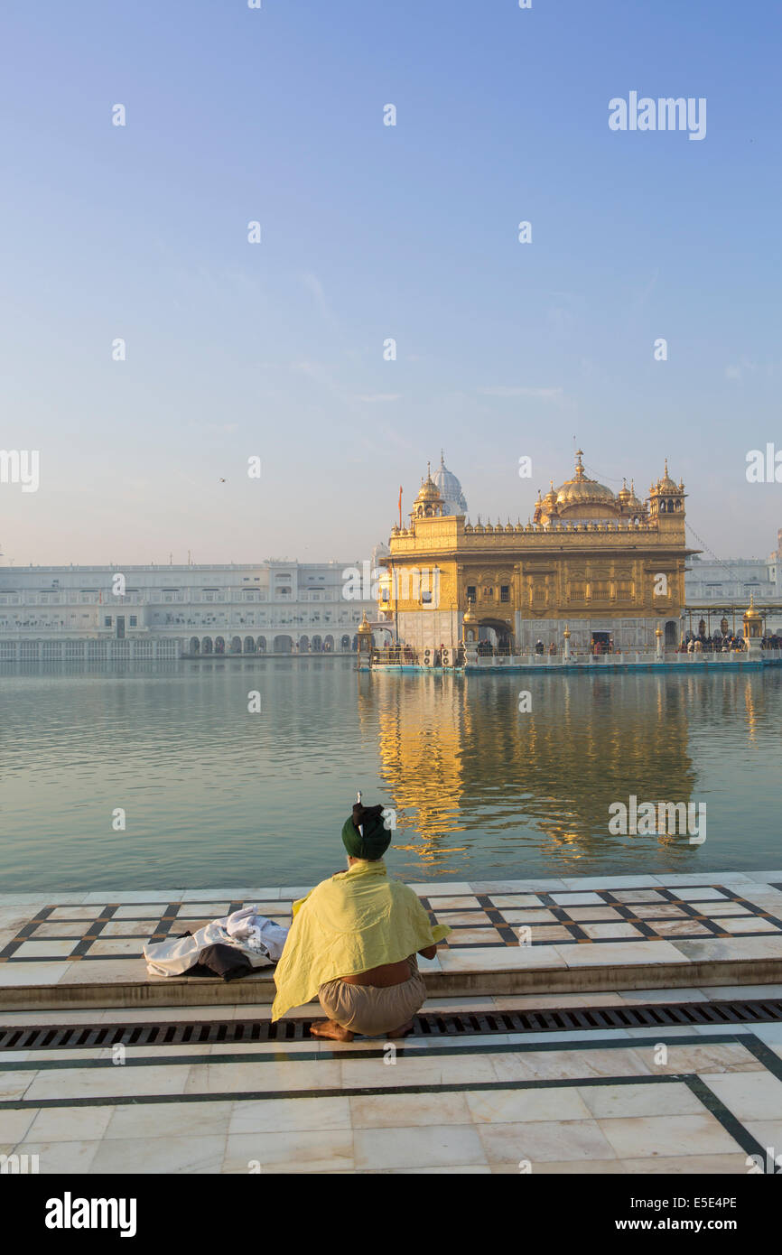 Pilgrim bathing at the Golden Temple in Amritsar, Punjab, India Stock Photo