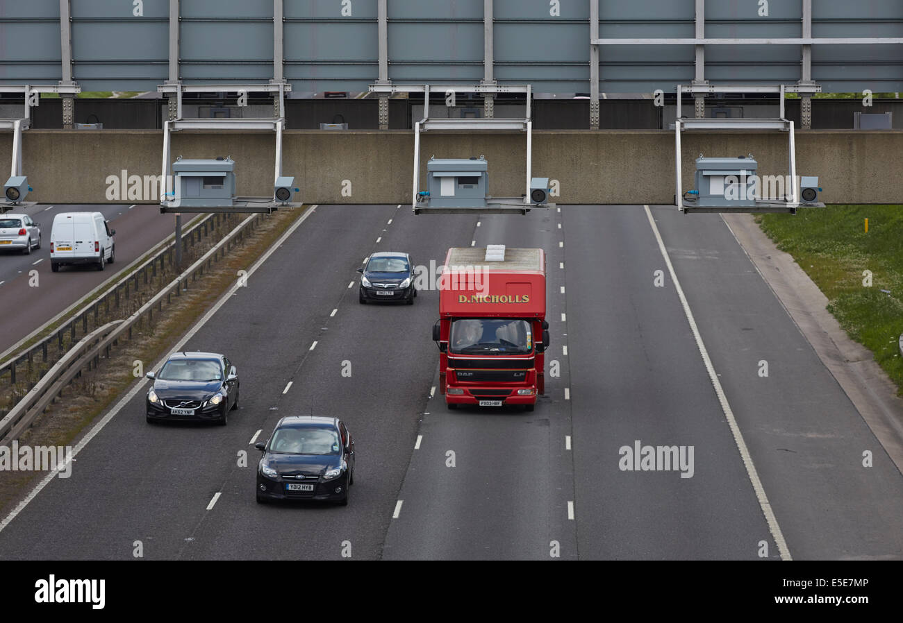 Gatso speed cameras on all lanes of the M! motorway on the gantry in a variable speed limit area Stock Photo