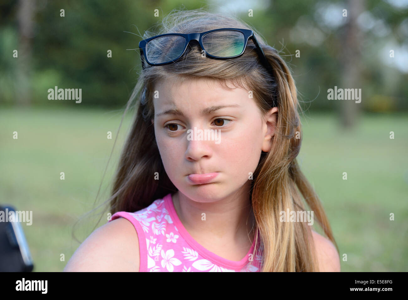 Pretty Little Blonde Girl Makes Faces Making A Selfie Stock Photo