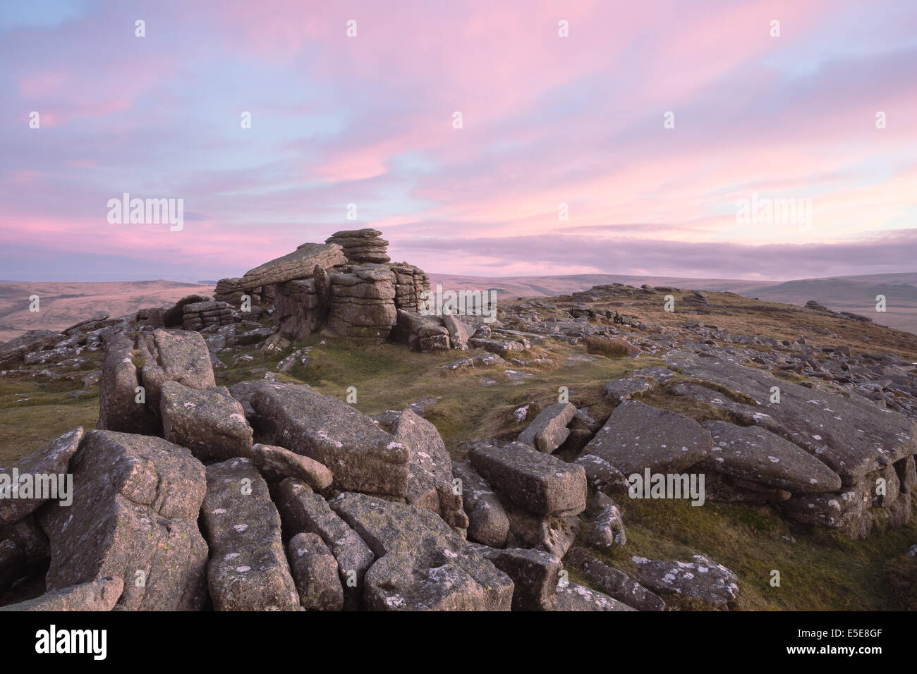 Soft pink sunset at Belstone Tor Dartmoor national park Devon Uk Stock Photo