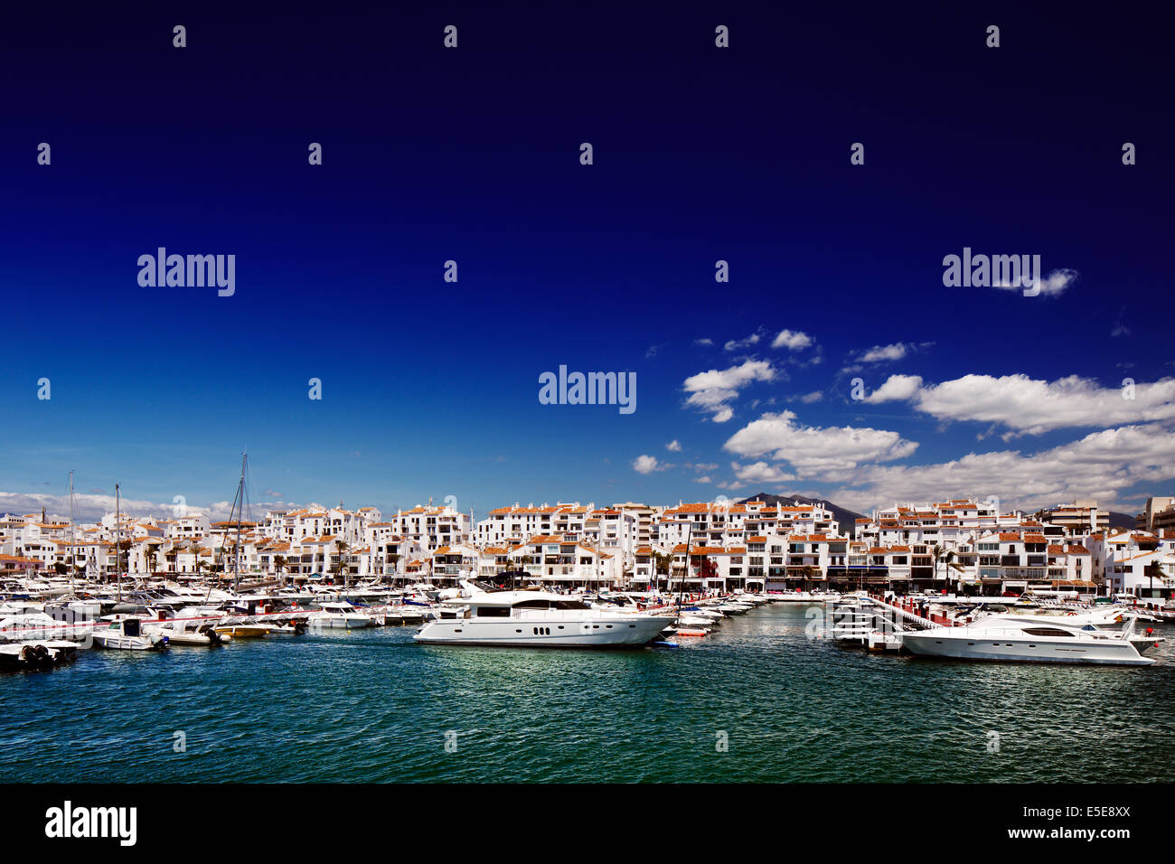 Luxury yachts and motor boats moored in Puerto Banus marina in Marbella, Spain. Marbella is a popular holiday destination Stock Photo