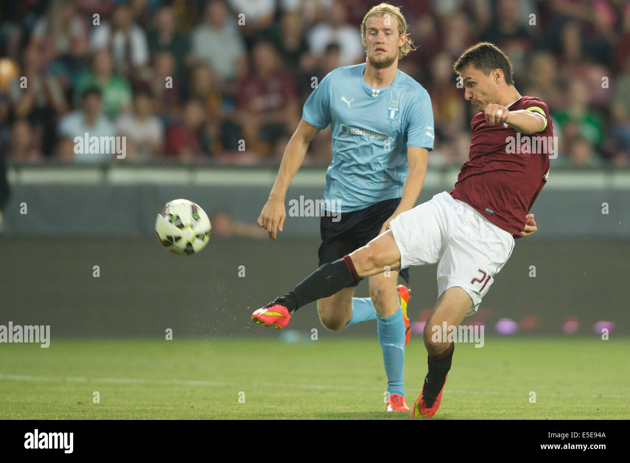 Prague, Czech Republic. 29th July, 2014. Filip Helander of Malmo (left) and David Lafata of Sparta are pictured during the UEFA Champions League 3rd qualifying round opening match AC Sparta Praha vs. Malmo FF, Prague, Czech Republic, on Tuesday, July 29, 2014. © CTK/Alamy Live News Stock Photo