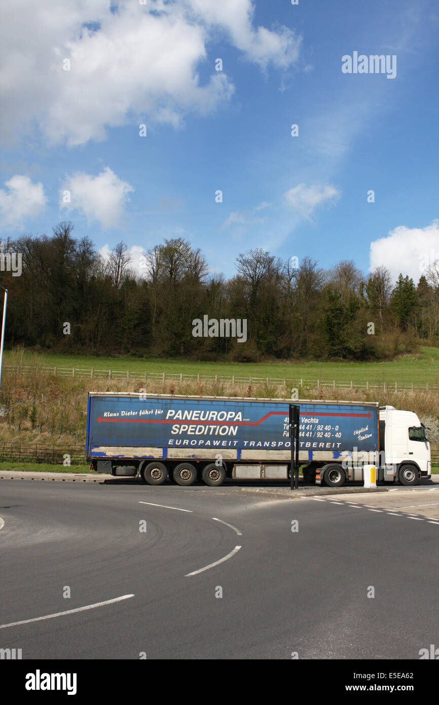 A Pan Europa Spedition articulated truck exiting a roundabout in Coulsdon, Surrey, England Stock Photo