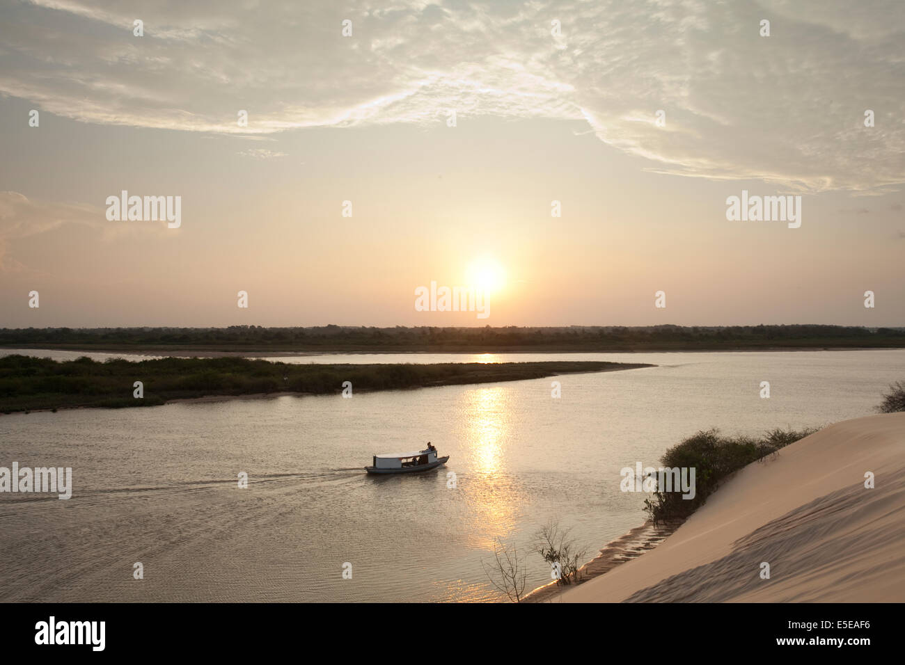 A boat on the Delta do Parnaiba wetlands at sunset, Piaui Stock Photo