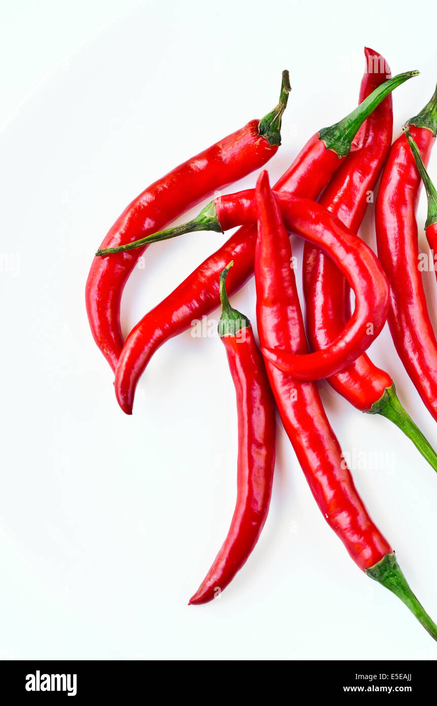 Red chili peppers on white background Stock Photo - Alamy