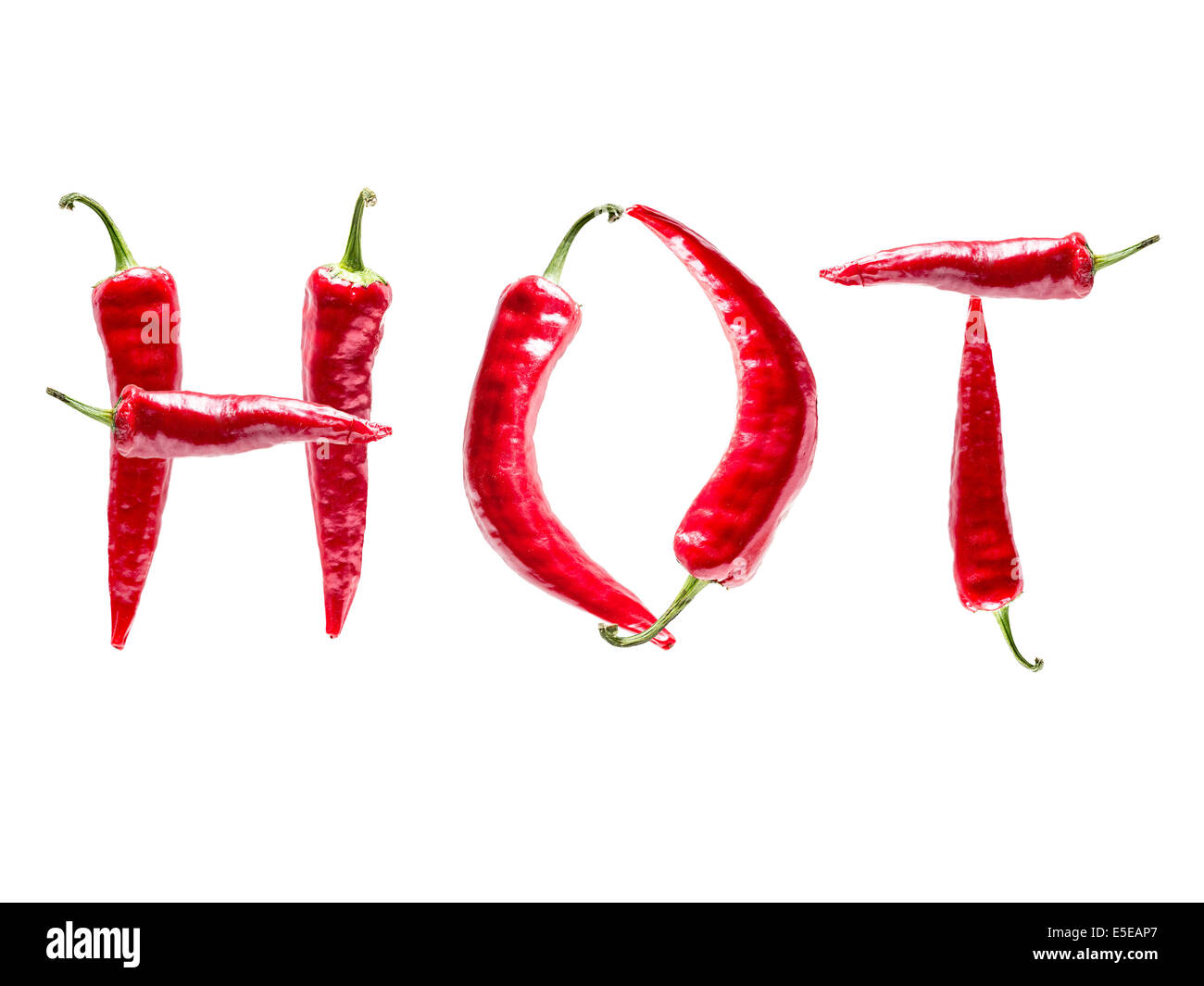 HOT word formed from red chili peppers shot on white Stock Photo