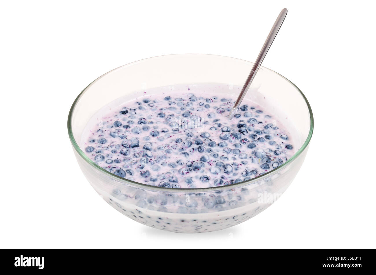 Blueberries with cream in a bowl isolated on white background with clipping path Stock Photo