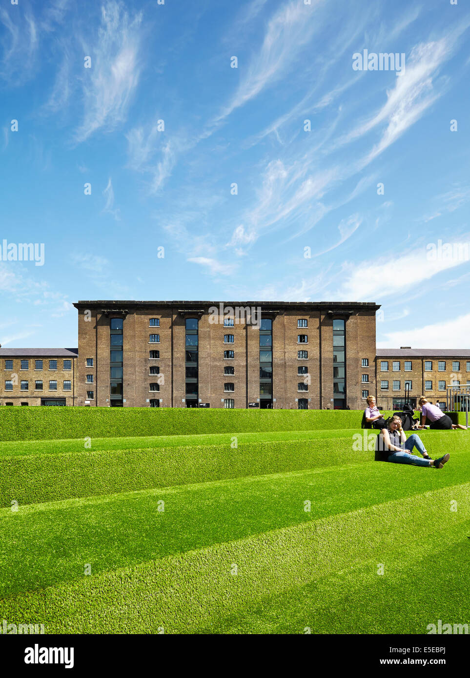 View of the Granary Complex, over the carpeted steps beside the Regent's Canal. Stock Photo