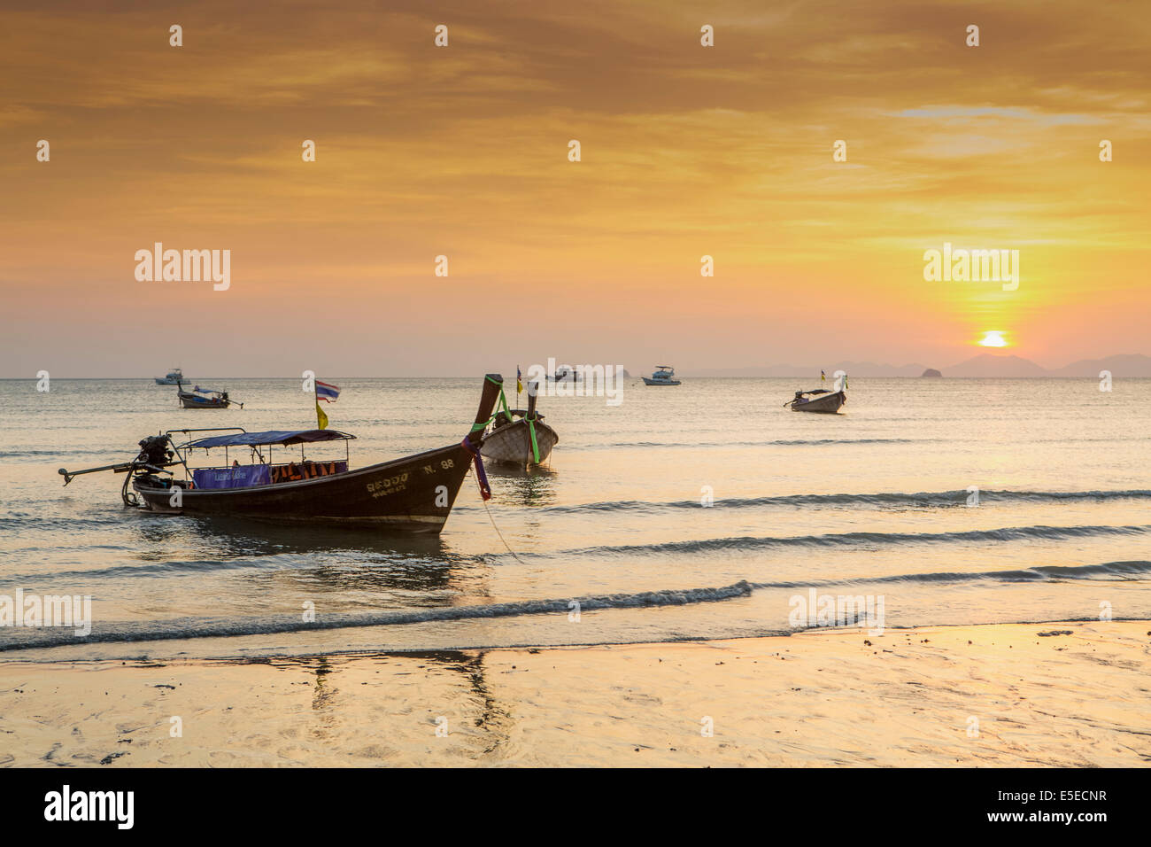 Long tail boats moored on Ao Nang beach, Krabi, Thailand Stock Photo