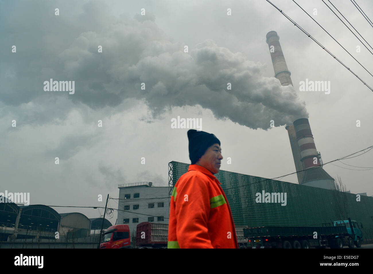 Black smoke emitted from the chimney of a private iron and steel factory in Tangshan, Hebei province, China. 26-Mar-2014 Stock Photo