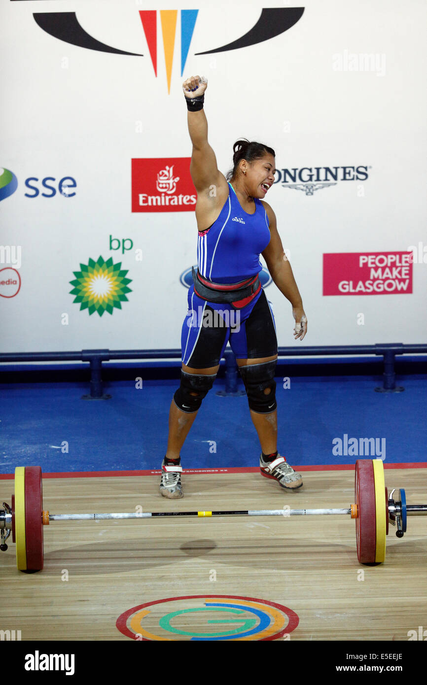 Clyde Auditorium, Glasgow, Scotland, UK, Tuesday, 29th July, 2014. Silver Medal Winner Mary Opeloge of Samoa celebrates after a making a lift during the Women’s 75kg Group A Weightlifting Final in the Glasgow 2014 Commonwealth Games Stock Photo