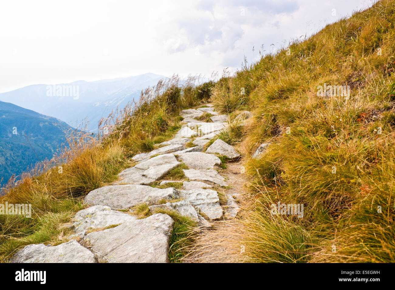 Path on the steep side of Kasprowy Wierch in Tatra mountains Stock Photo