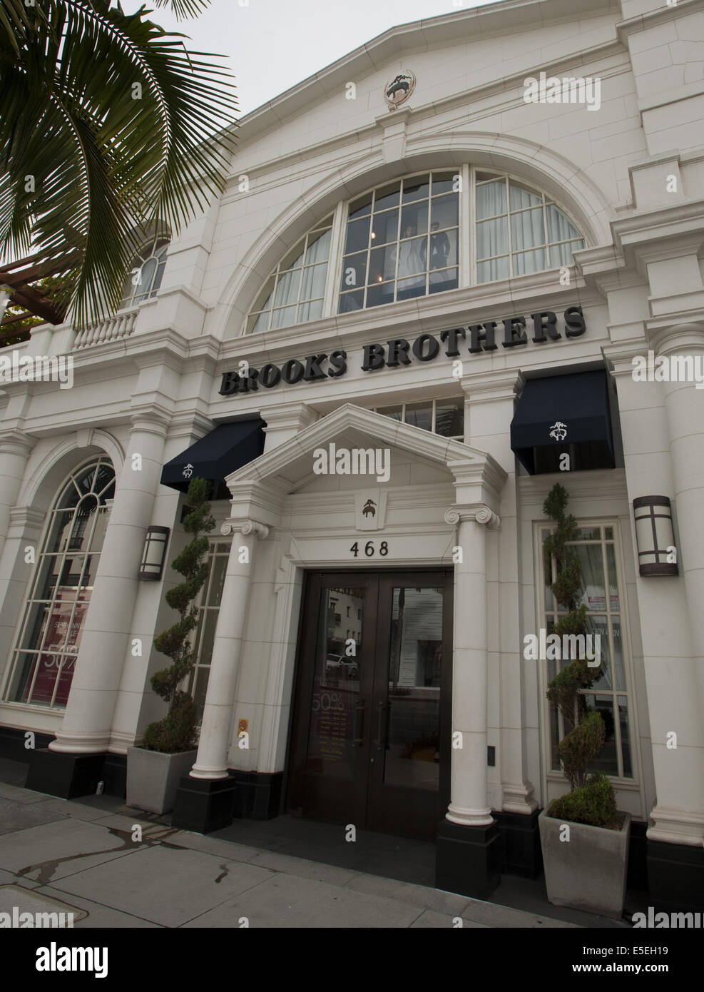 June 21, 2014 - Beverly Hills/Los Angeles, California, U.S - Brooks Brothers on Rodeo Drive, founded in 1818 as a family business in New York City, is the oldest mens clothing chain in the United States and now, since 2001, offers women's clothes---Rodeo Drive, in the heart of Beverly Hills, is a two-way, two mile long, north south city street with a mix of small to large luxury homes, city parks and green areas as well as world class high end signature flagship stores and shops with globally known luxury goods at it's south end.---Beverly Hills, ranch land originally known as Rancho Rodeo de  Stock Photo