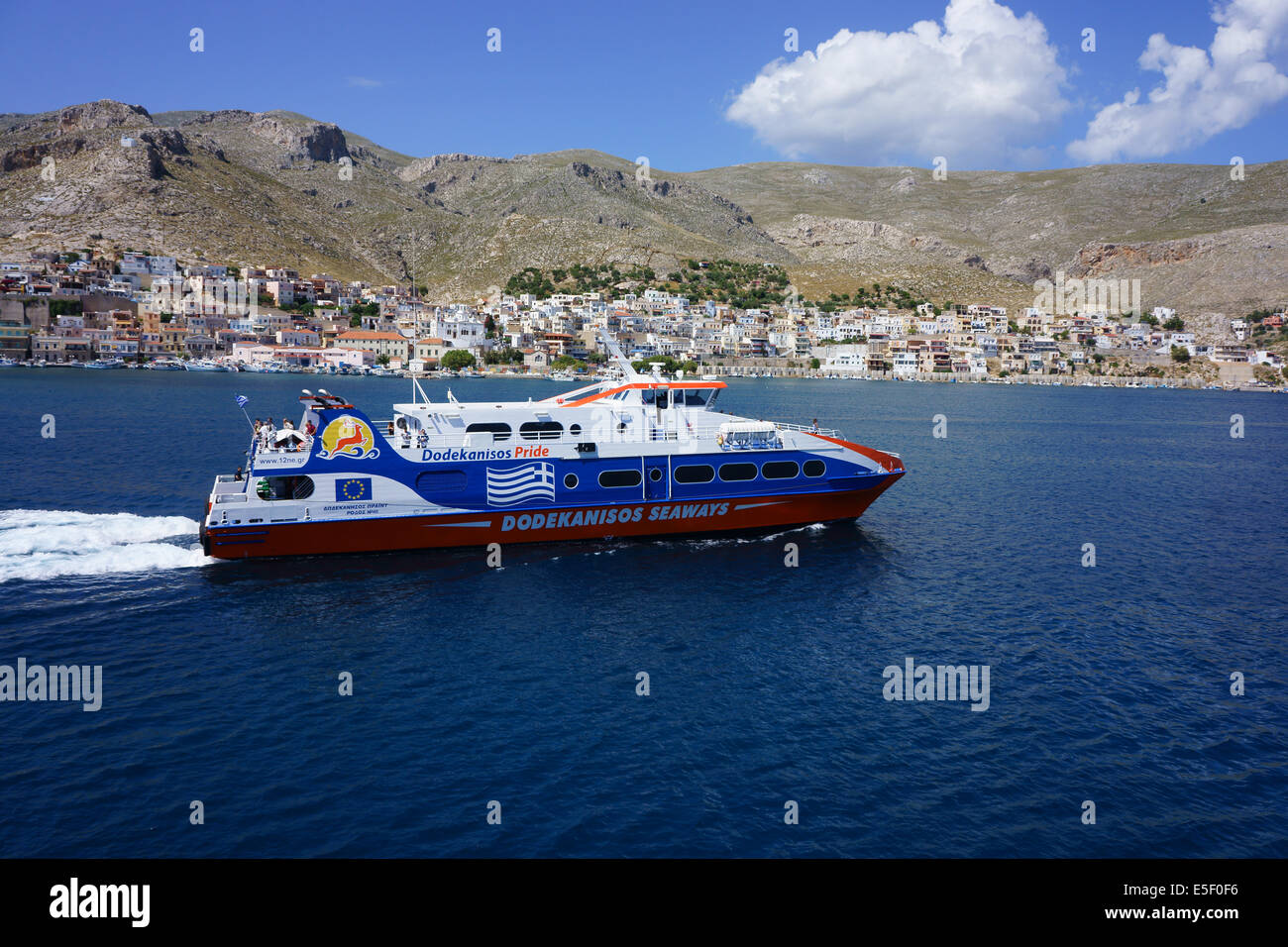 Katamaran High Speed Ferry boat leaving harbor of Pothia, Island Kalymnos, Greece Stock Photo