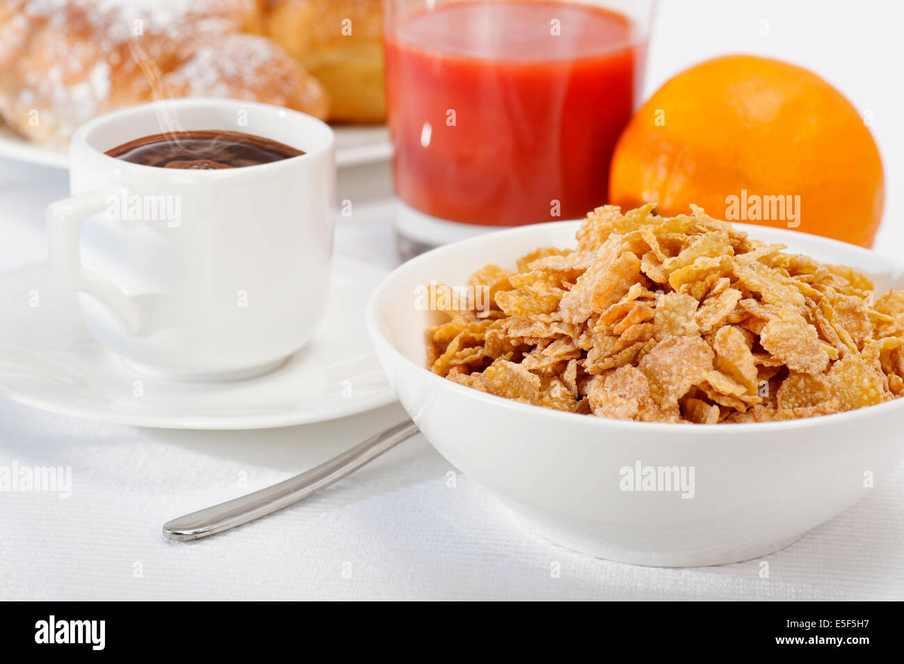 continental breakfast with corn flakes, coffee, orange juice and