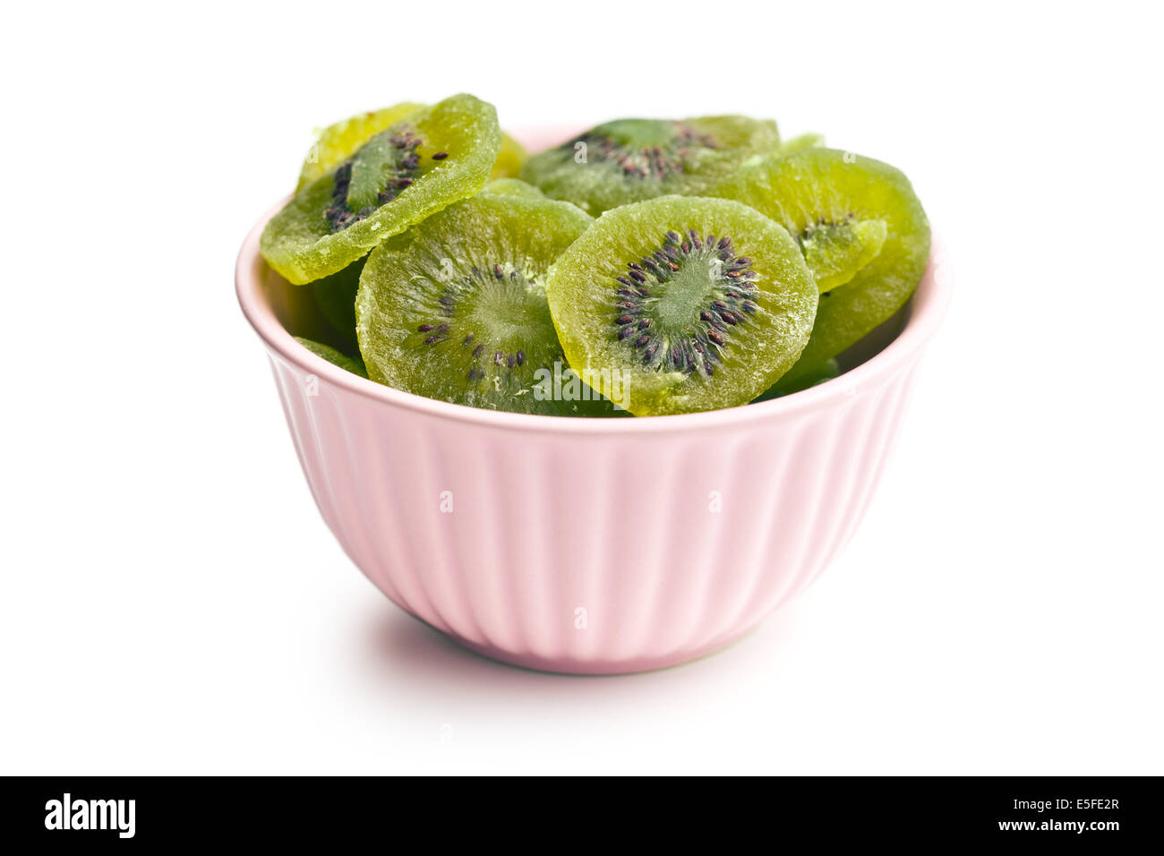 candied kiwi fruit in bowl on white background Stock Photo Alamy