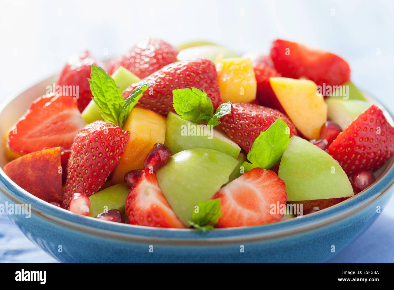 fresh fruit salad with strawberry, apple, nectarine, pomegranate Stock