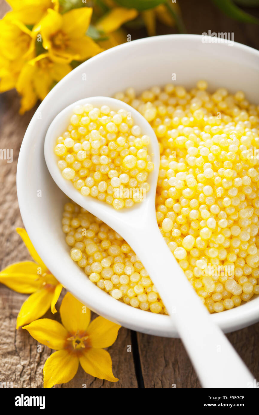 spa with yellow herbal bath pearls and flowers Stock Photo Alamy