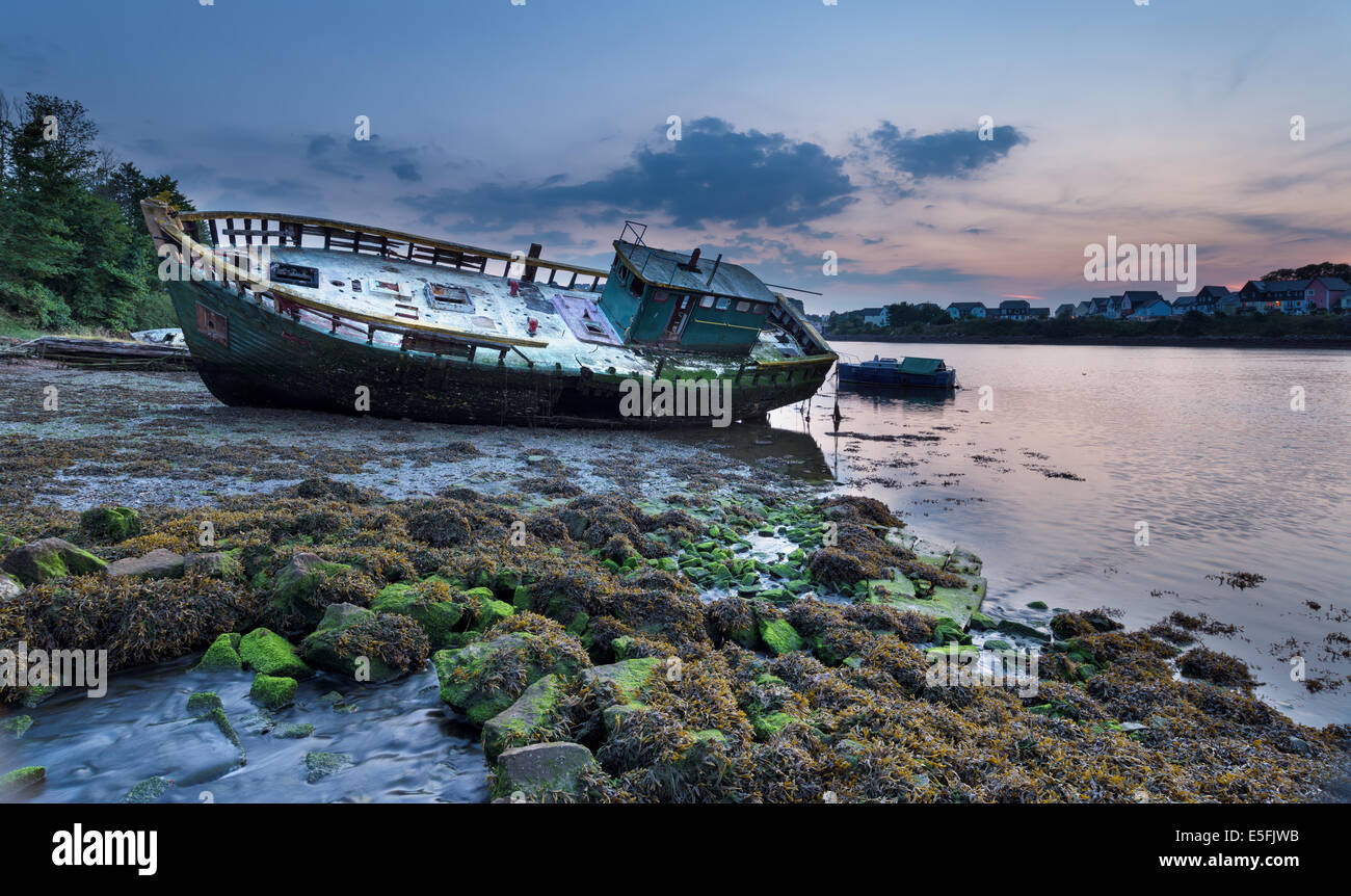 Old abandoned wooden fishing trawler resting on the shore Stock Photo ...