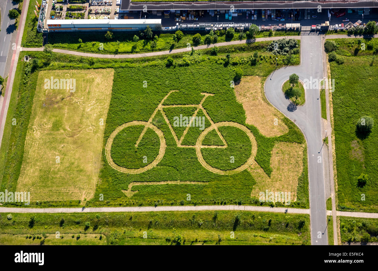 Aerial view, Eco-Center NRW with a big bike mowed into a field, Hamm, Ruhr district, North Rhine-Westphalia, Germany Stock Photo