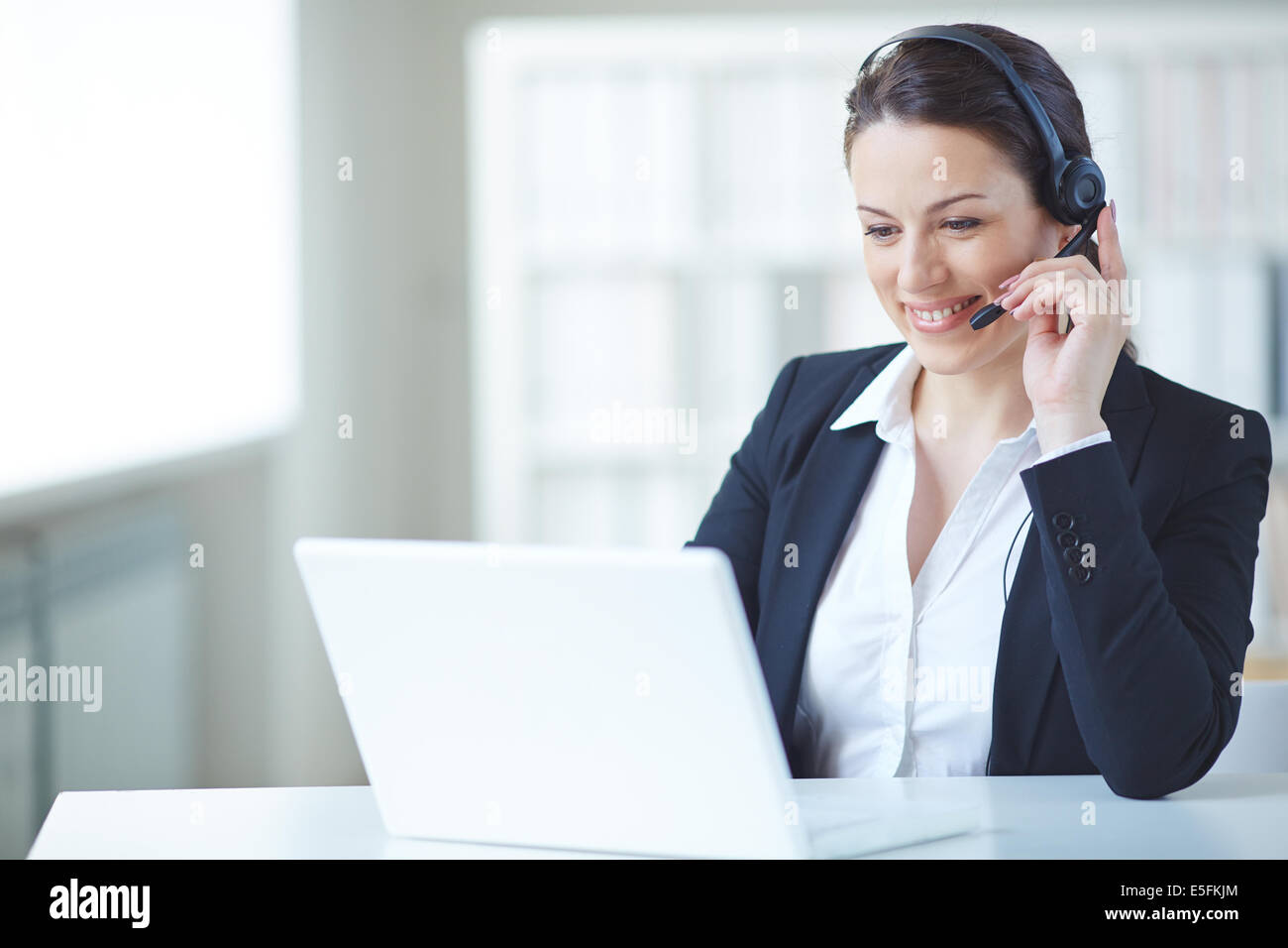 Young customer support representative consulting client on-line Stock ...