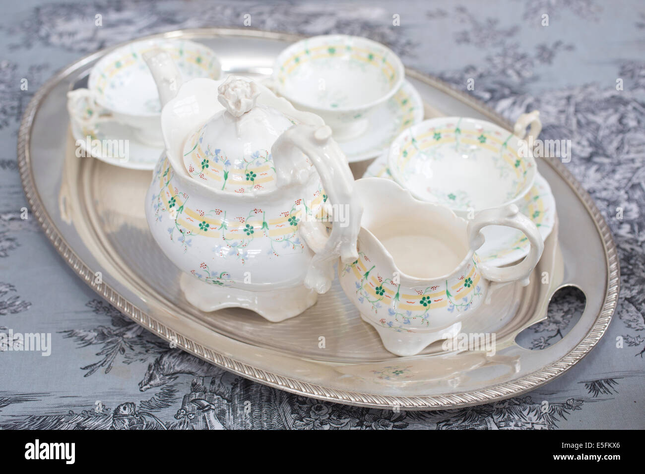 Bone China tea pot and cups and saucers with milk jug at Rare Tea Company, blended loose leaf teas from across the world. Stock Photo