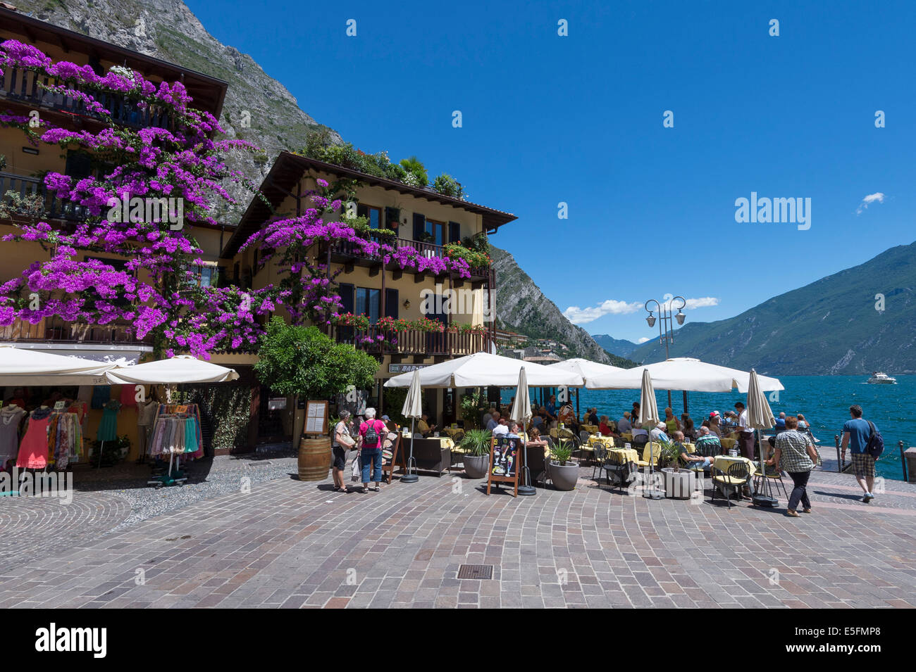 Square with restaurant, Lake Garda, Limone sul Garda, Lombardy, Italy Stock Photo