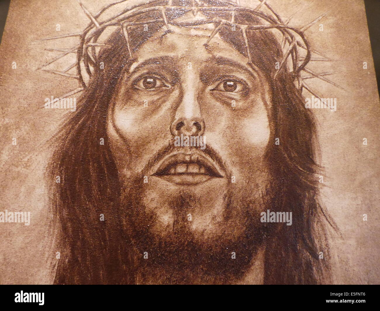 Manila, Philippines. 29th July, 2014. A coffee painting of Christ with