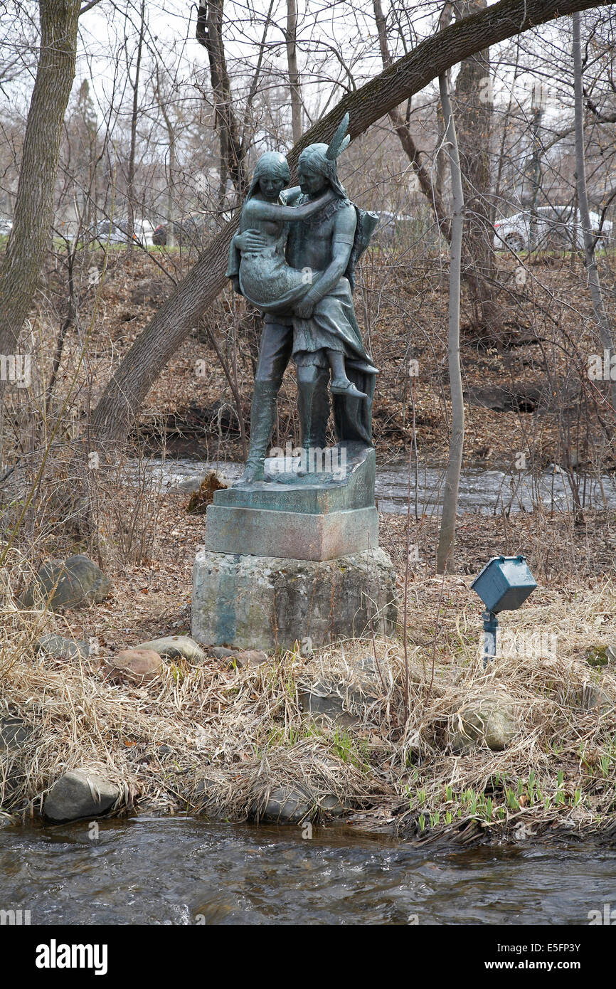 A Statue by Jakob Fjelde of Hiawatha carrying Minnehaha across Minnehaha Creek Minnehaha Park Minneapolis Minnesota USA Stock Photo