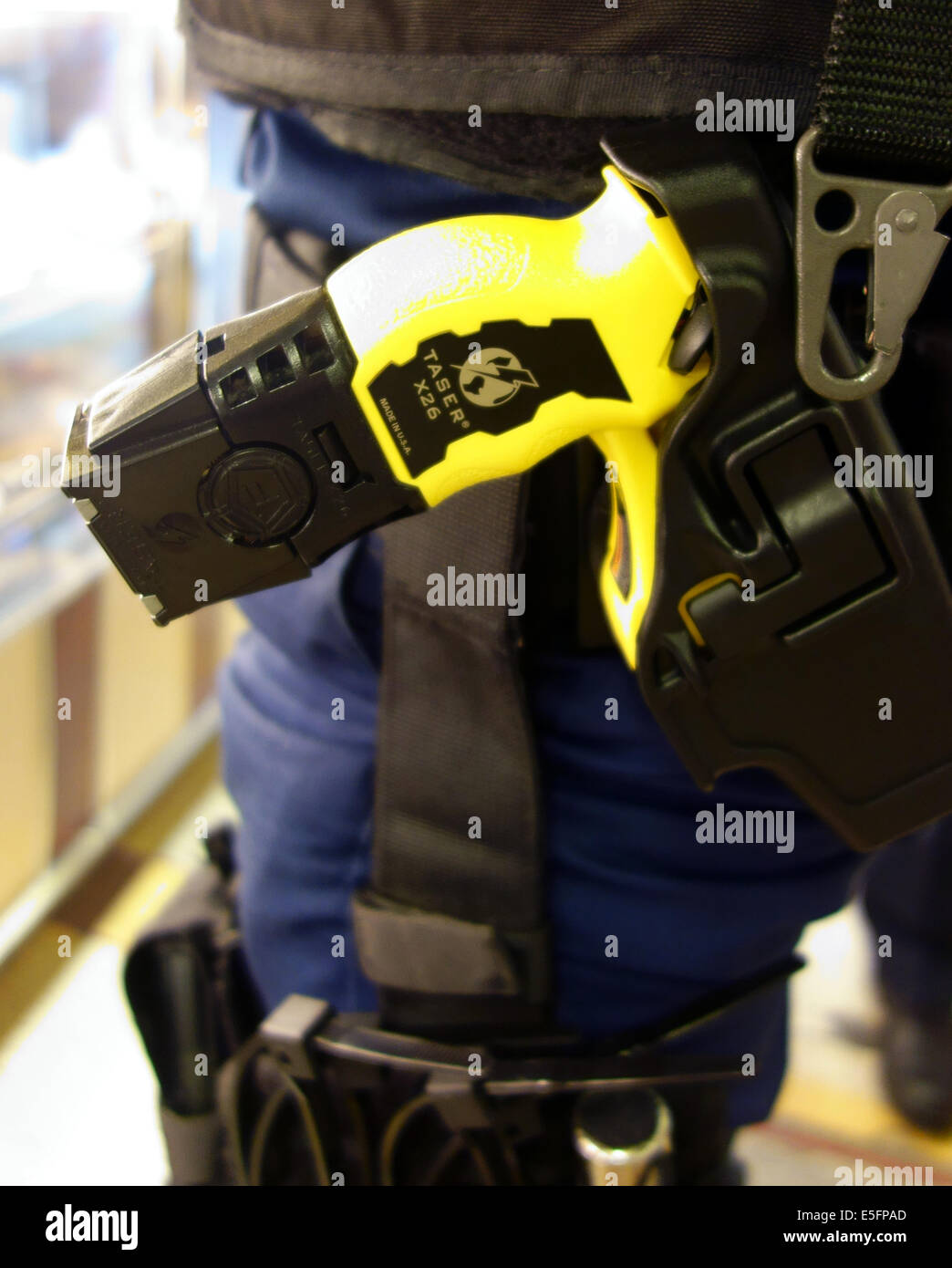 Taser in holster worn by armed police officer, Central London Stock Photo