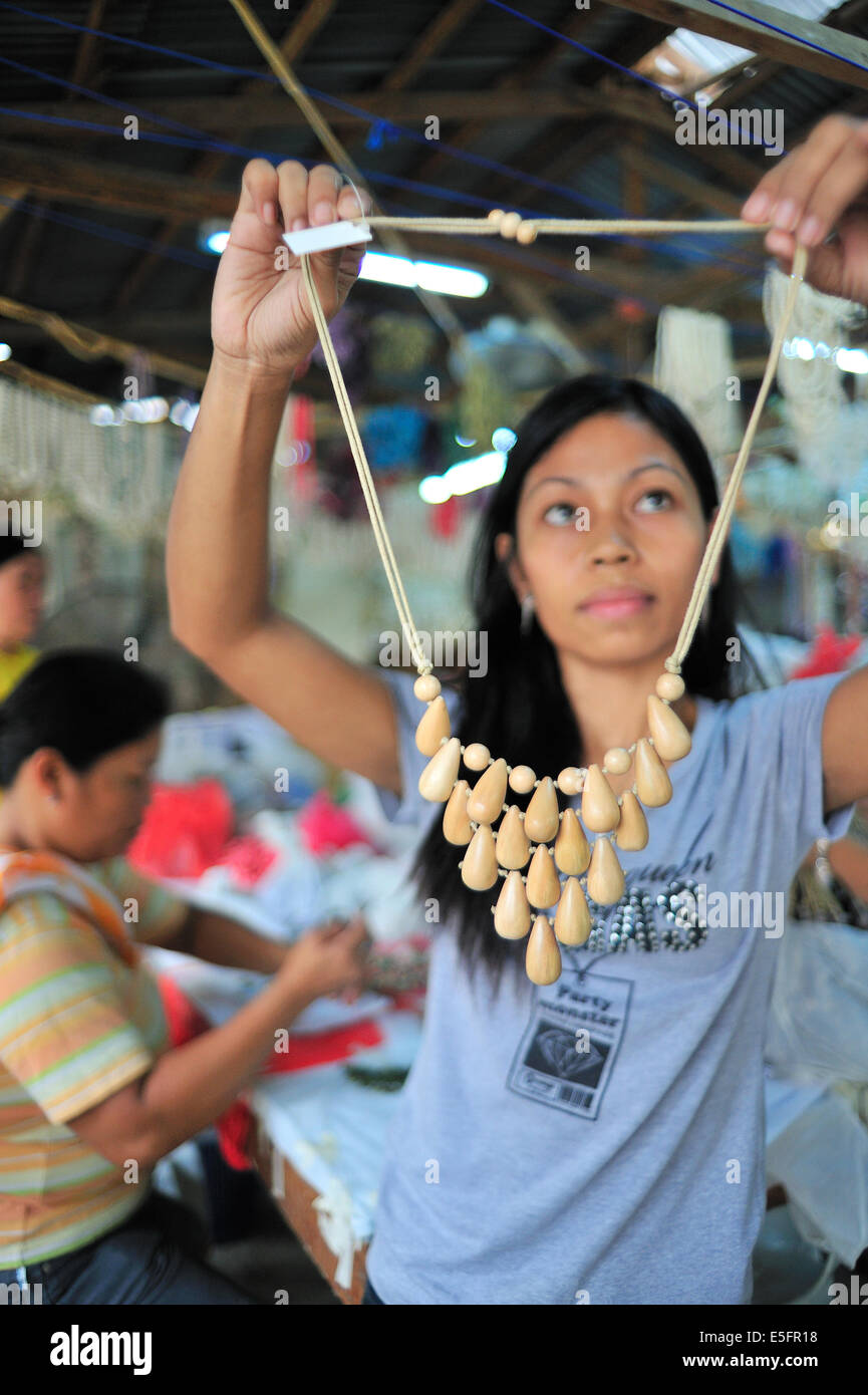 Filipina Checking Hand Made Fashion Jewelry Stock Photo