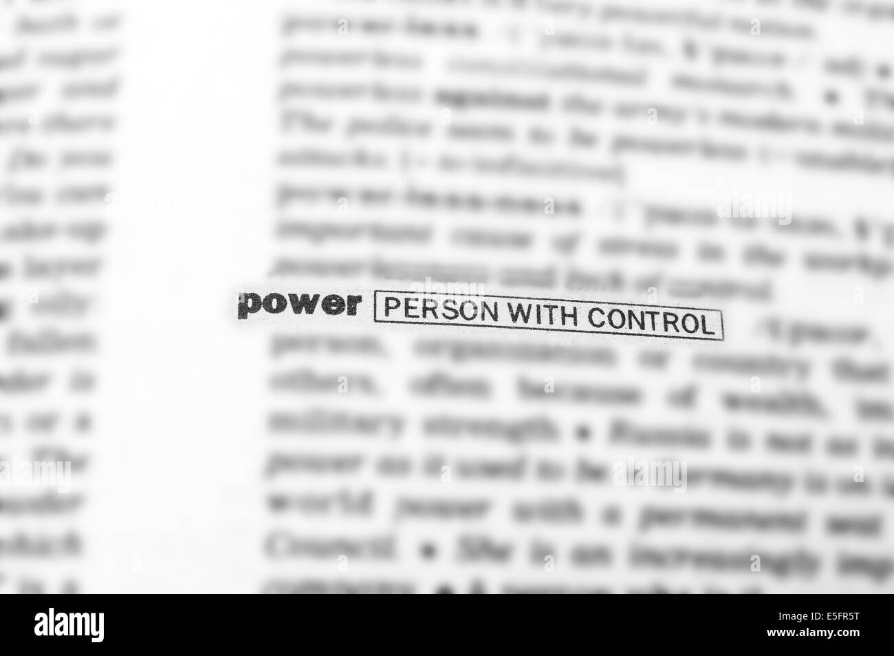 Blurred text in dictionary with focus on POWER. Stock Photo