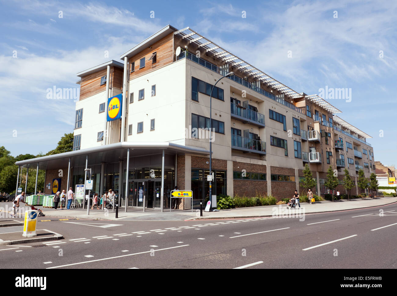 A recently built branch of Lidl  on Lee Highroad, Lewisham, which also forms part of a larger block of apartment's. Stock Photo