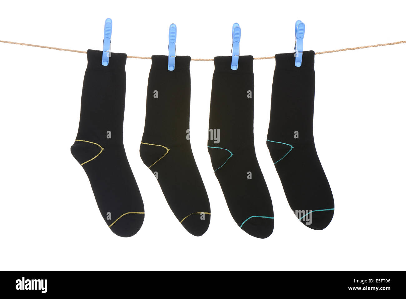 socks hanging to dry over white background Stock Photo